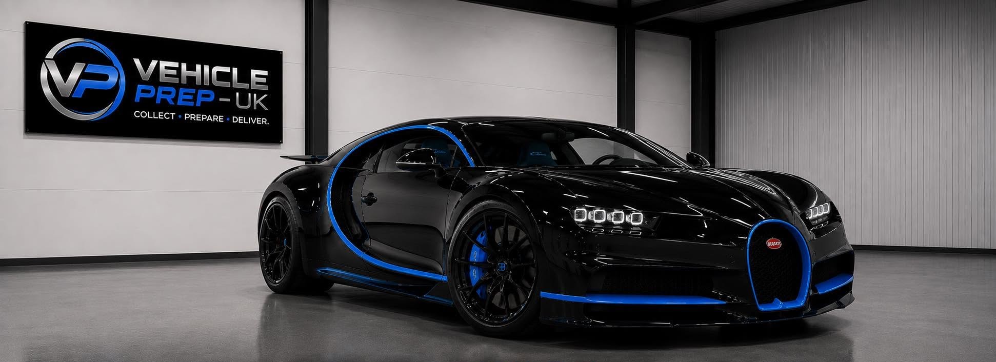 A Bugatti Chiron under the Vehicle Prep UK sign in the workshop.